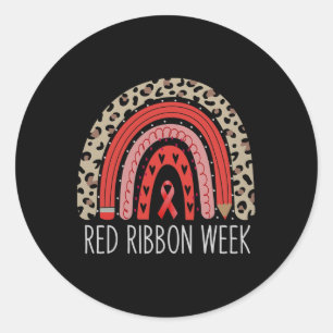 Pegatina Redonda Usamos Rojo Para La Semana De La Cinta Roja Concie