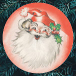 Pegatina Redonda Vintage Christmas, Jolly Retro 50s Santa Claus<br><div class="desc">Vintage illustration Merry Christmas holiday design featuring a jolly Santa Claus. Old Saint Nick has a big fluffy white beard and is wearing a traditional furry hat decorated with holly leaves and berries. His laughing face is featured on a bright red background. A fun 50s retro kitschy feel.</div>