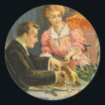 Pegatina Redonda Vintage Christmas, Victorian Family Dinner<br><div class="desc">Ilustracion de época Victoriano. Imagen de feriado de Feliz Navidad con una cena familiar en la víspera de Navidades. El padre está tallando la carne asada mientras la madre está sirviendo comida y el niño está esperando pacientemente usando sus modales.</div>