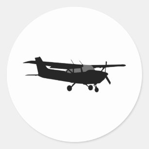 Pegatina Redonda Vuelo negro clásico de la silueta de Cessna de los