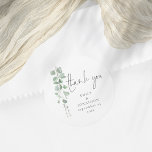 Pegatina Redonda Watercolor Eucalyptus Nombres Fecha Gracias Boda<br><div class="desc">Acuarela Eucalyptus Nombres Fecha Gracias Boda. Las elegantes hojas de eucalipto acuarela corren hacia abajo desde la parte superior izquierda. Personaliza fácilmente tus nombres y la fecha de boda.</div>