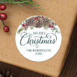 Pegatina Redonda Watercolor Pine Cone Script Merry Christmas Green<br><div class="desc">Estos stickers de Navidad personalizados son excelentes para sellos para sobres en tu correo de vacaciones, regalos y favores, y más. Presentan una elegante caligrafía de escritura, nombre familiar y año, y están decorados con pinos acuarelas, brotes verdes y bayas rojas borgoñas. Consulta la colección para ver los productos que...</div>
