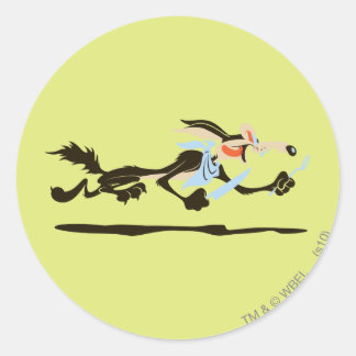 Pegatina Redonda WILE E. COYOTE™ Persiguiendo la cena