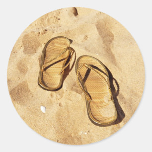 Pegatina Redonda zapatillas doradas en la playa