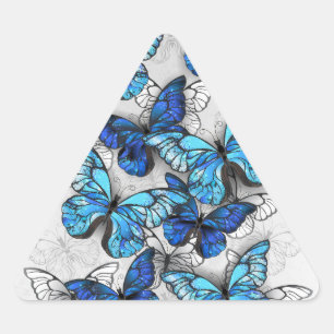 Pegatina Triangular Composición de las mariposas blancas y azules