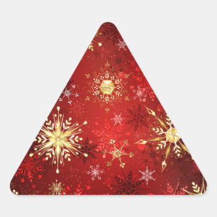 Pegatina Triangular Navidades Copos de nieve dorados con fondo rojo