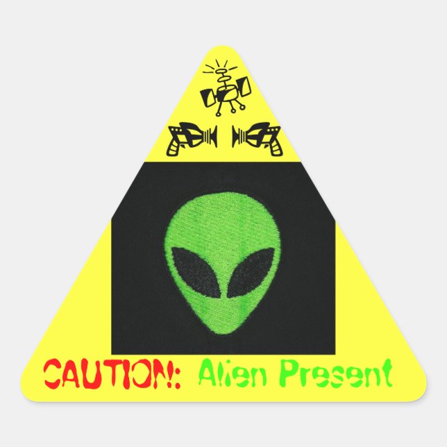 PEGATINA TRIANGULAR PRECAUCIÓN: ALIEN PRESENTE (Anverso)