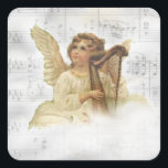 Pegatina Vintage Christmas Angel<br><div class="desc">Un ángel vintage toca un arpa sobre una nube. En el fondo hay un desplazamiento de la música de las hojas detrás de la niebla de las nubes.</div>