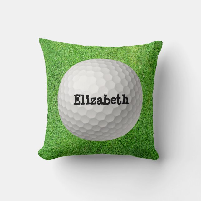 Pelota de golf en la almohada verde (Anverso)