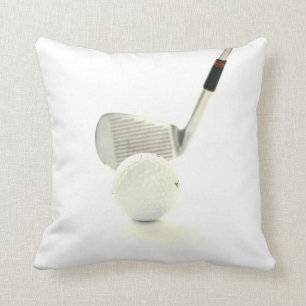 Pelota de golf y almohada del club