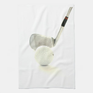 Pelota de golf y toalla de cocina del club