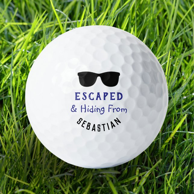Pelotas De Golf Divertidas gafas de sol de Guay escapadas y oculta (A funny personalized golf ball with dark sunglasses picture and 'escaped and hiding' caption)