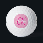 Pelotas De Golf Iniciales de monograma de nombre rosado<br><div class="desc">Fondo rosado,  texto rosa caliente y blanco. Personalice y agregue sus iniciales y nombre de monograma. El nombre está escrito con una escritura de estilo con letras a mano moderna.</div>