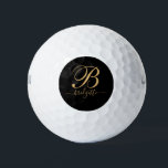Pelotas De Golf Monograma De Guión Oro En Negro<br><div class="desc">Un elegante monograma dorado con las iniciales y el nombre del guión tipografía bola de golf. Personalizado en una tipografía de escritura elegante.</div>
