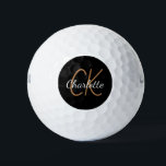 Pelotas De Golf Nombre minimalista de las iniciales del monograma<br><div class="desc">Fondo negro,  texto dorado y blanco. Personalice y agregue sus iniciales y nombre de monograma. Tanto para él como para ella. El nombre está escrito con una escritura de estilo con letras a mano moderna.</div>