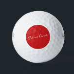 Pelotas De Golf Tipografía de script personalizada Nombre Navidade<br><div class="desc">Celebra la temporada de fiestas con estilo con estas pelotas de golf con un nombre personalizado en elegante tipografía de escritura, ambientada con un clásico fondo rojo Navidad. Perfecto para los golfistas que quieran añadir un toque festivo a su juego o como un regalo de vacaciones. El diseño audaz y...</div>