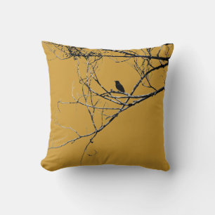 Pequeña almohada negra de pájaro