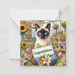 Pequeña Florismo de gatos con tarjeta de felicitaciones