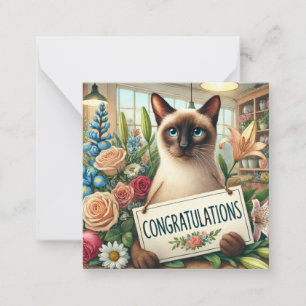 Pequeña Florismo de gatos con tarjeta de felicitaciones