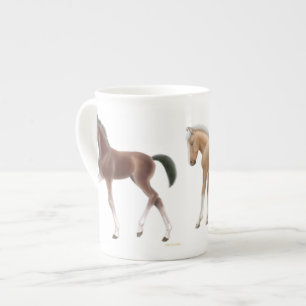 Pequeña taza juguetona de la porcelana de hueso d