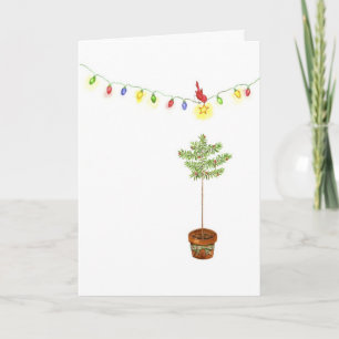 Pequeño árbol de navidad rojo del pájaro