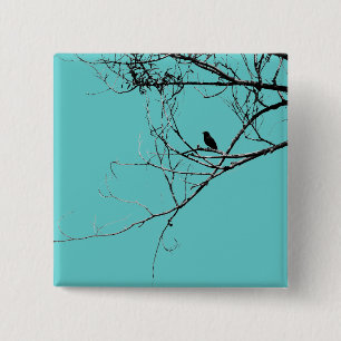 Pequeño botón negro de pájaro