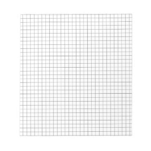 Pequeño cuaderno de notas del papel cuadriculado