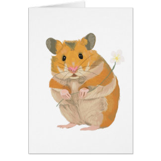 Pequeño Hamster lindo sosteniendo una flor
