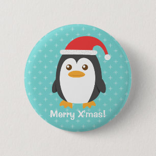 Pequeño pingüino lindo con el botón de Navidad del