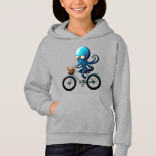 Pequeño pulpo azul lindo en una bicicleta