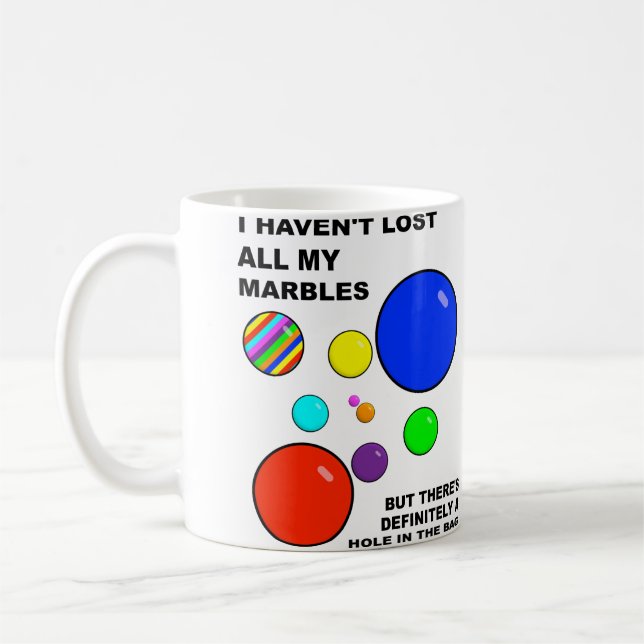 Perder mi taza divertida de los mármoles (Izquierda)