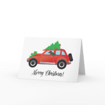 Perro andulado afgano - auto con árbol de Navidad