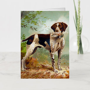 Perro cazador con pájaro en la boca