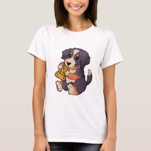 Perro de montaña de Berna come camiseta de pizza