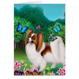 Perro de Papillon en jardín del jardín
