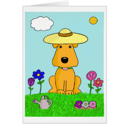 Perro de perrito lindo en la tarjeta del jardín