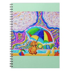 Perro en un cuaderno de playa