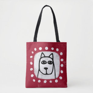 Perro gracioso en la bolsa roja de la tota