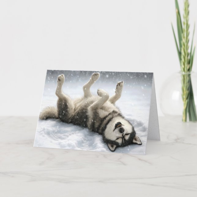 Perro Husky Siberiano de Navidad haciendo un ángel (Anverso)