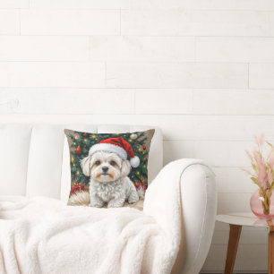 Perro maltés navidad en una almohada azul