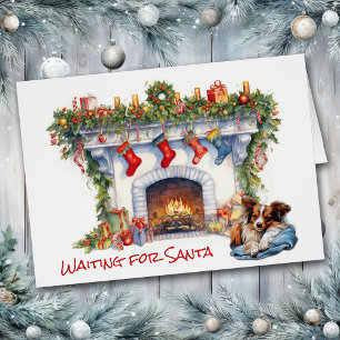 Perro Papillon espera la chimenea de Santa Navidad