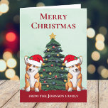 Perro personalizado de árbol de navidad de Corgi 2<br><div class="desc">Estos hermosos perros Pembroke Welsh Corgi tienen la cabeza inclinada dentro de un lindo gorra de Santa Claus. Las dos crías están sentadas frente a un árbol de Navidad bonito decorado con adornos coloridos. Bonita tarjeta de vacaciones de corgis con un maravilloso dibujo de un dúo de corgi rojo y...</div>