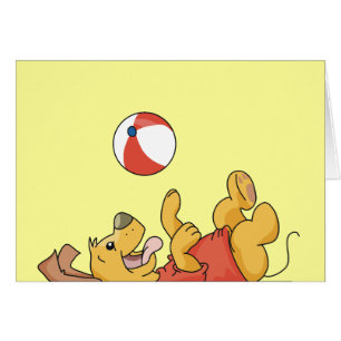 Perro que juega con las camisetas y los regalos de