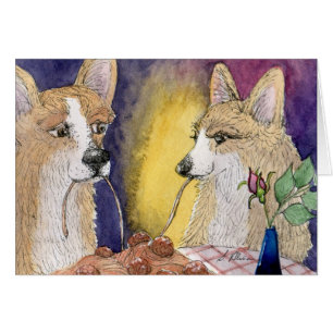 Perros del Corgi que comen los espaguetis y las