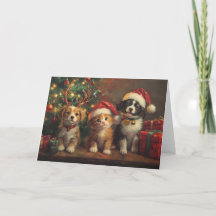 Perros y gatos lindos debajo del árbol de Navidad