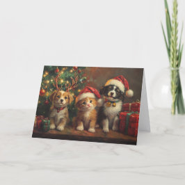 Perros y gatos lindos debajo del árbol de Navidad