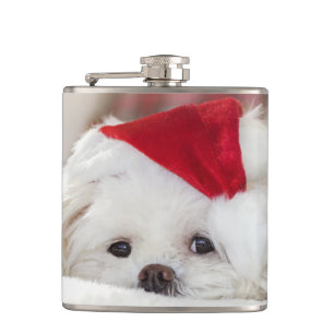 Petaca Perro blanco lindo en un sombrero rojo de Navidad