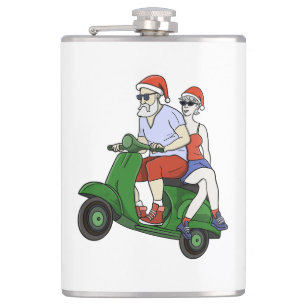 Petaca Santa y la Sra. Claus montando una moto