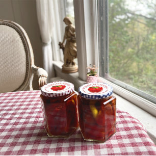 Pimientos rostados rojos en la etiqueta de aceite