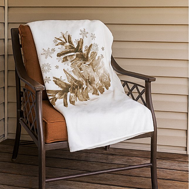 Pineconas rústicas en la manta de la nieve (Warm and cozy pinecone and snowflake fleece blanket.  )